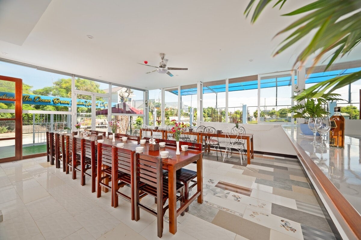 The restaurant by day, open towards the pool